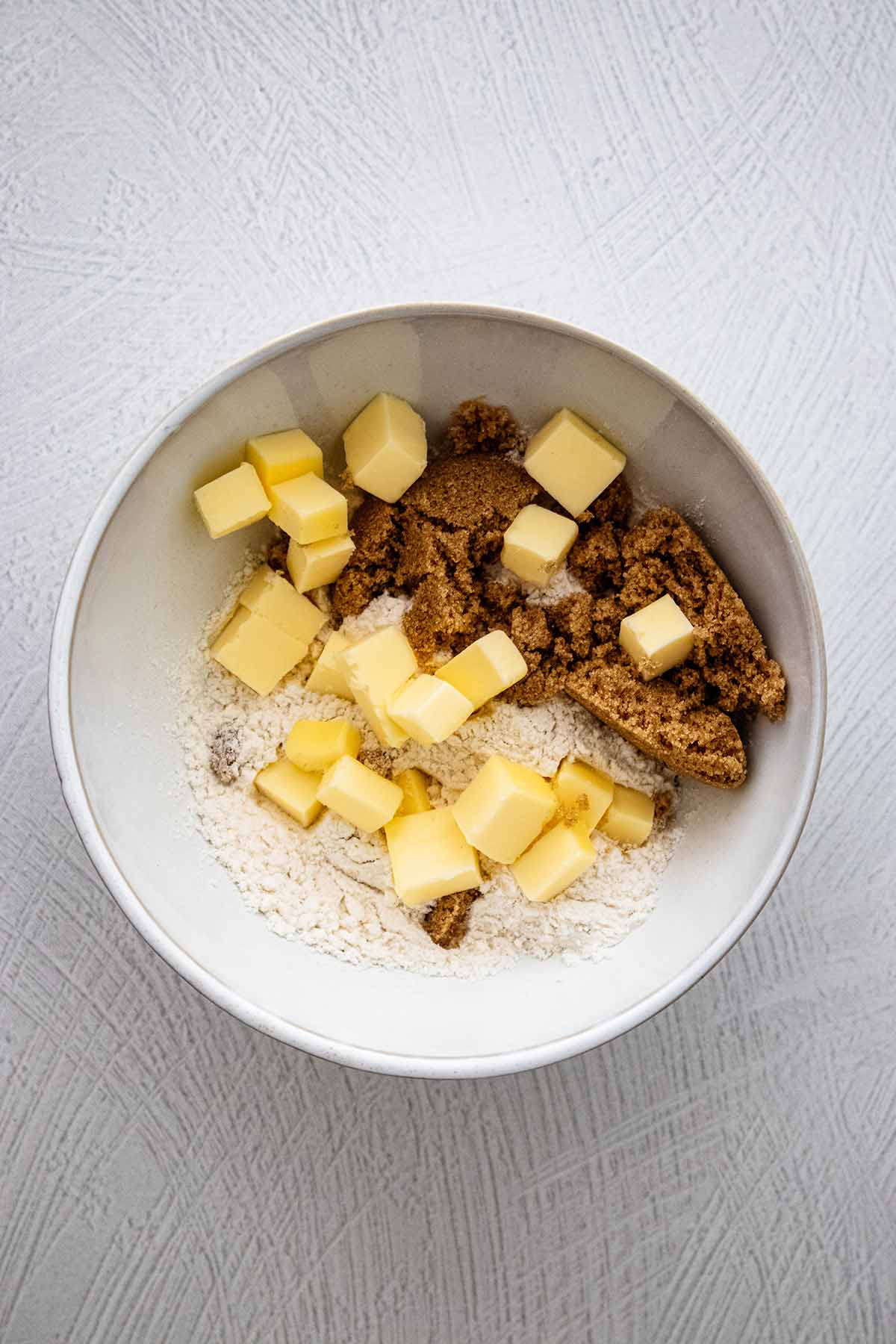 Crumble topping ingredients in a small white bowl.