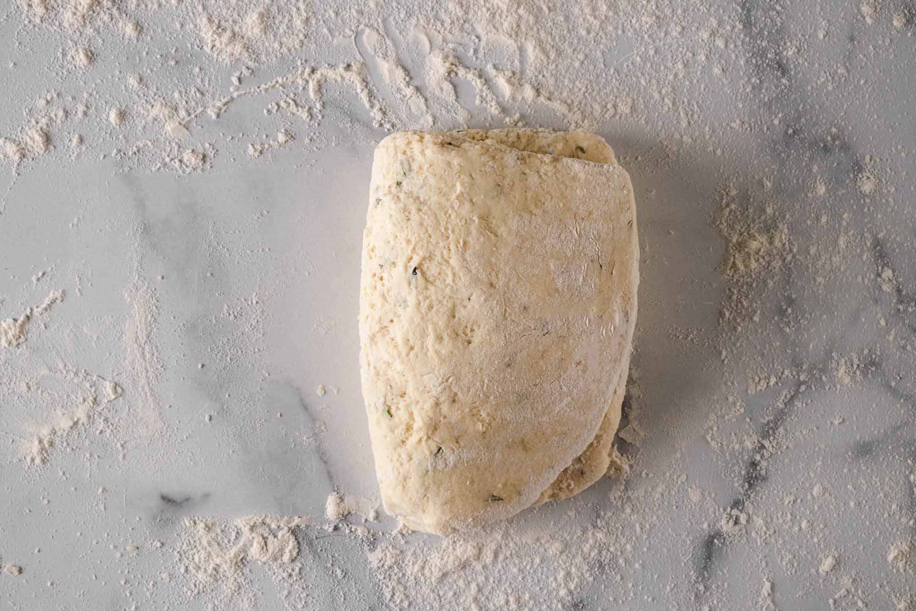 Dough folded over on itself.