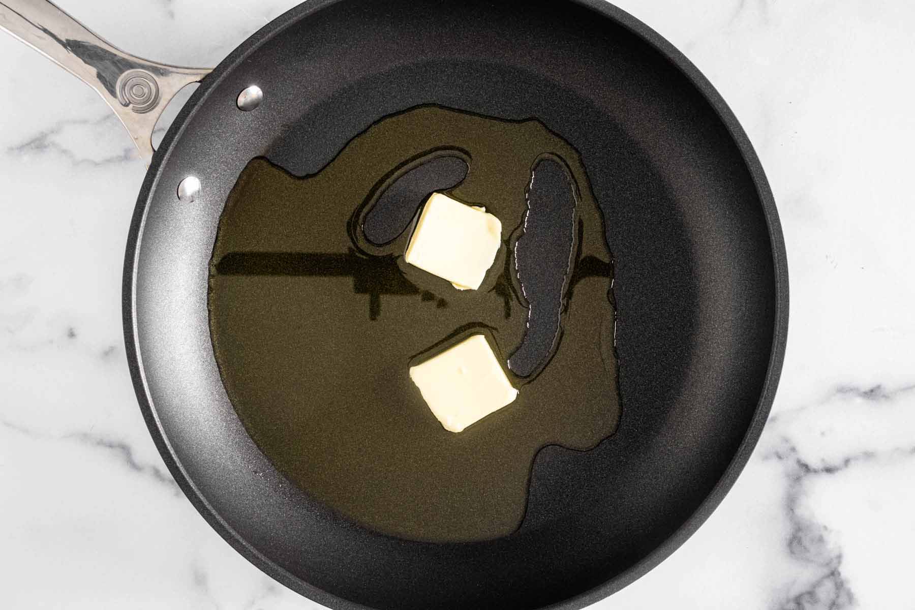 Olive oil and two tablespoons butter in a skillet.