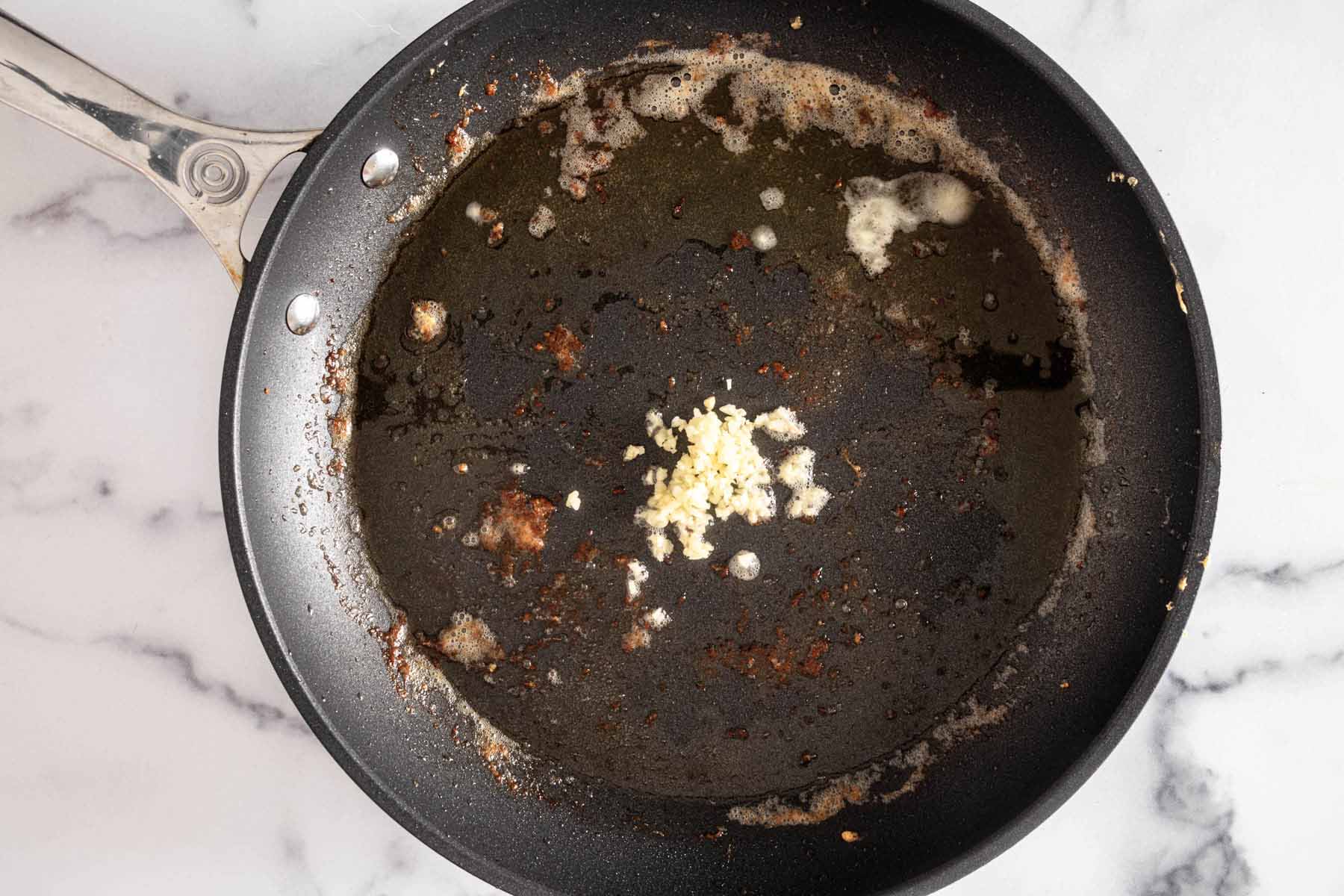 Minced garlic in hot skillet.