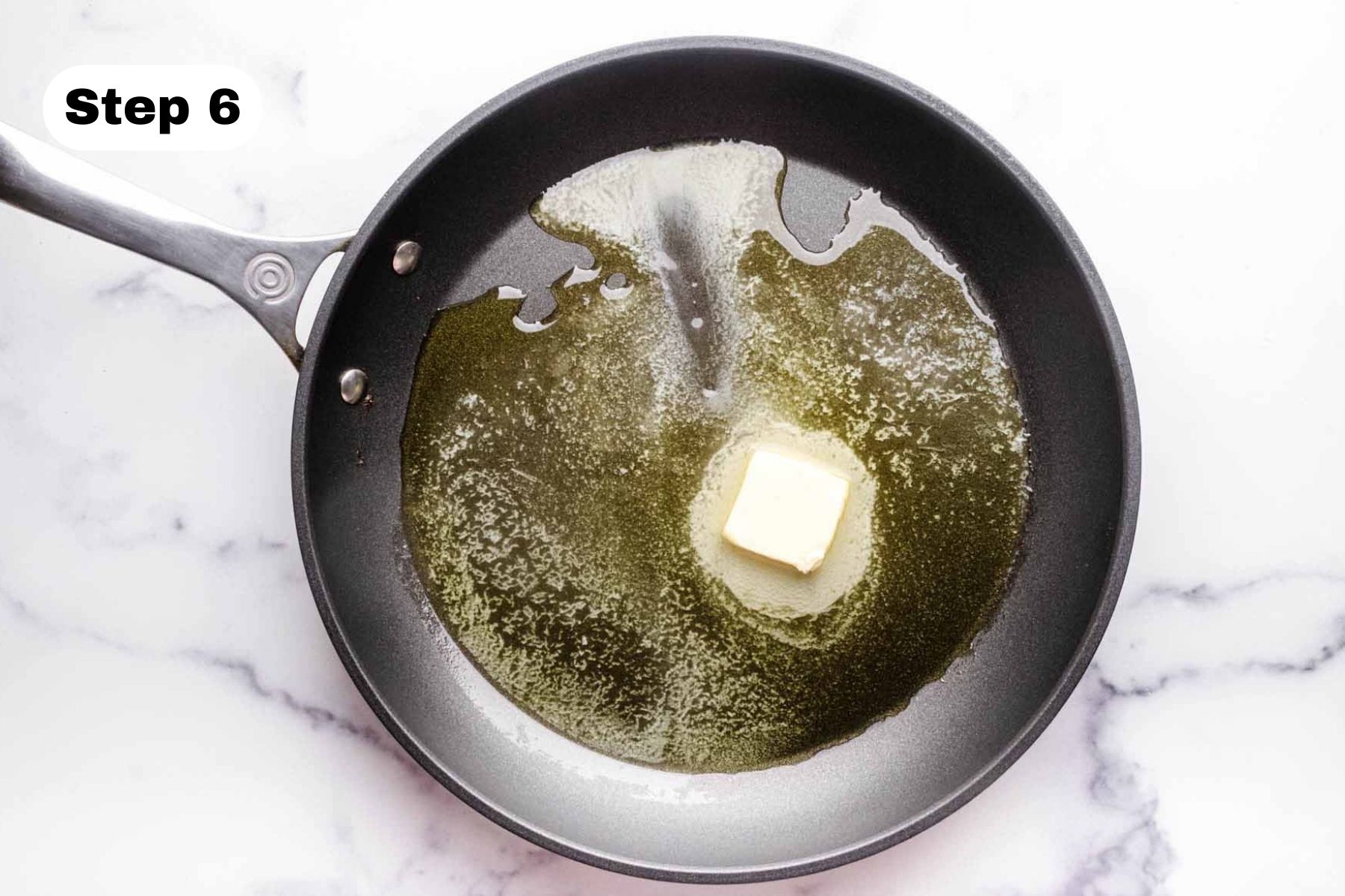 Olive oil and butter in a large skillet.