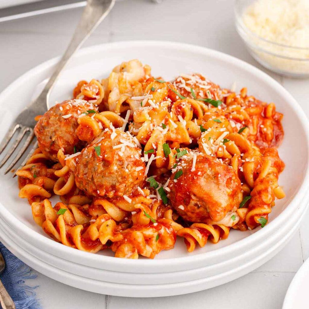 Serving of meatball casserole on a white plate.