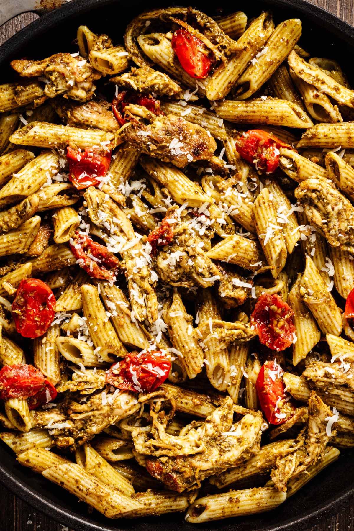 Close up of pesto chicken pasta in a skillet