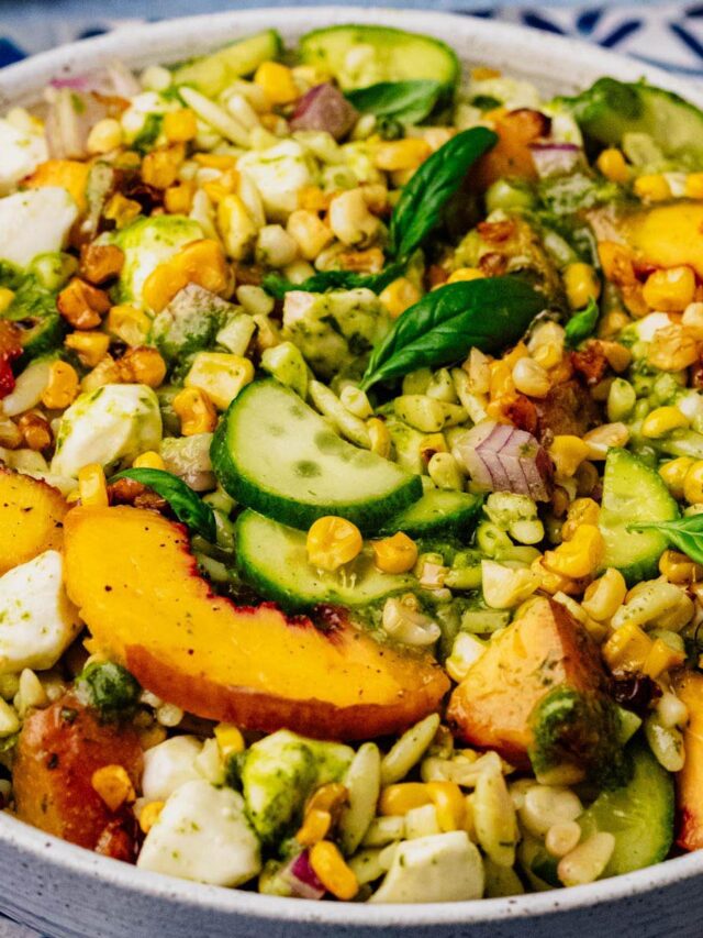 Summer orzo salad with grilled peaches, corn, cucumber, mozzarella, and basil vinaigrette.