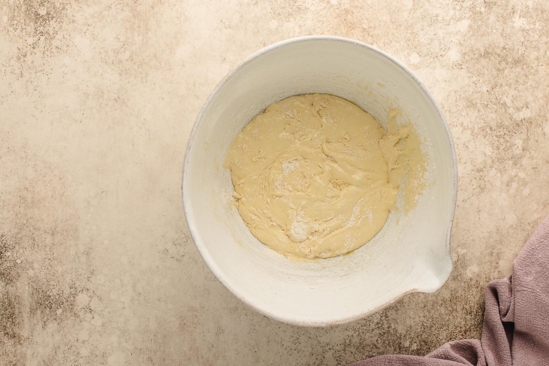 Batter partially combined after gently folding in the dry ingredients.