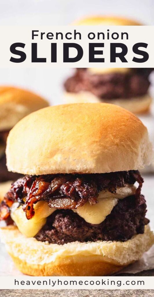 Close-up of a French onion slider on a soft bun, topped with caramelized onions and melted cheese over a beef patty, with more sliders blurred in the background.