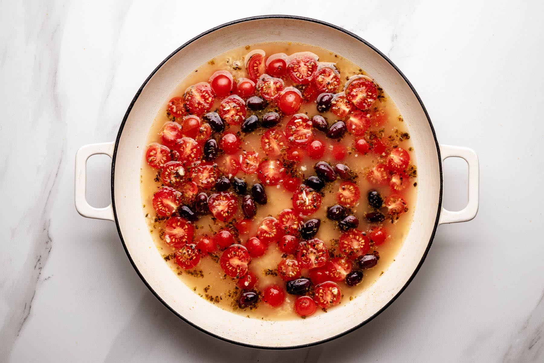Broth, lemon, cherry tomatoes, and Kalamata olives stirred into toasted rice.
