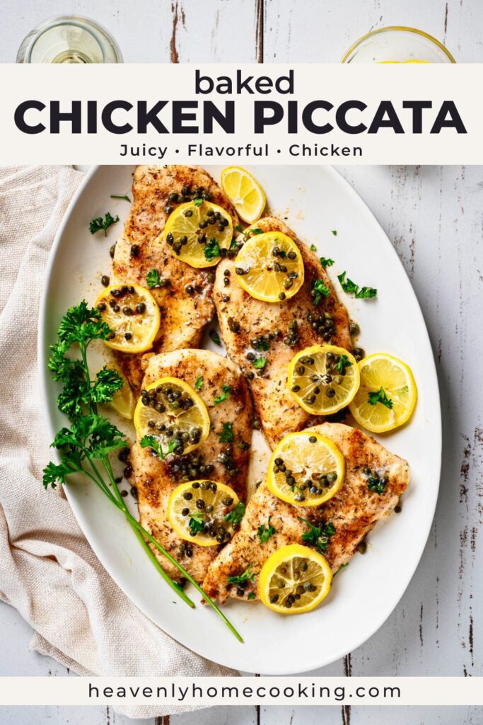 Plated baked chicken piccata topped with lemon slices, capers, and fresh parsley on a white serving platter. Vertical Pinterest pin for a juicy baked chicken piccata recipe from Heavenly Home Cooking.