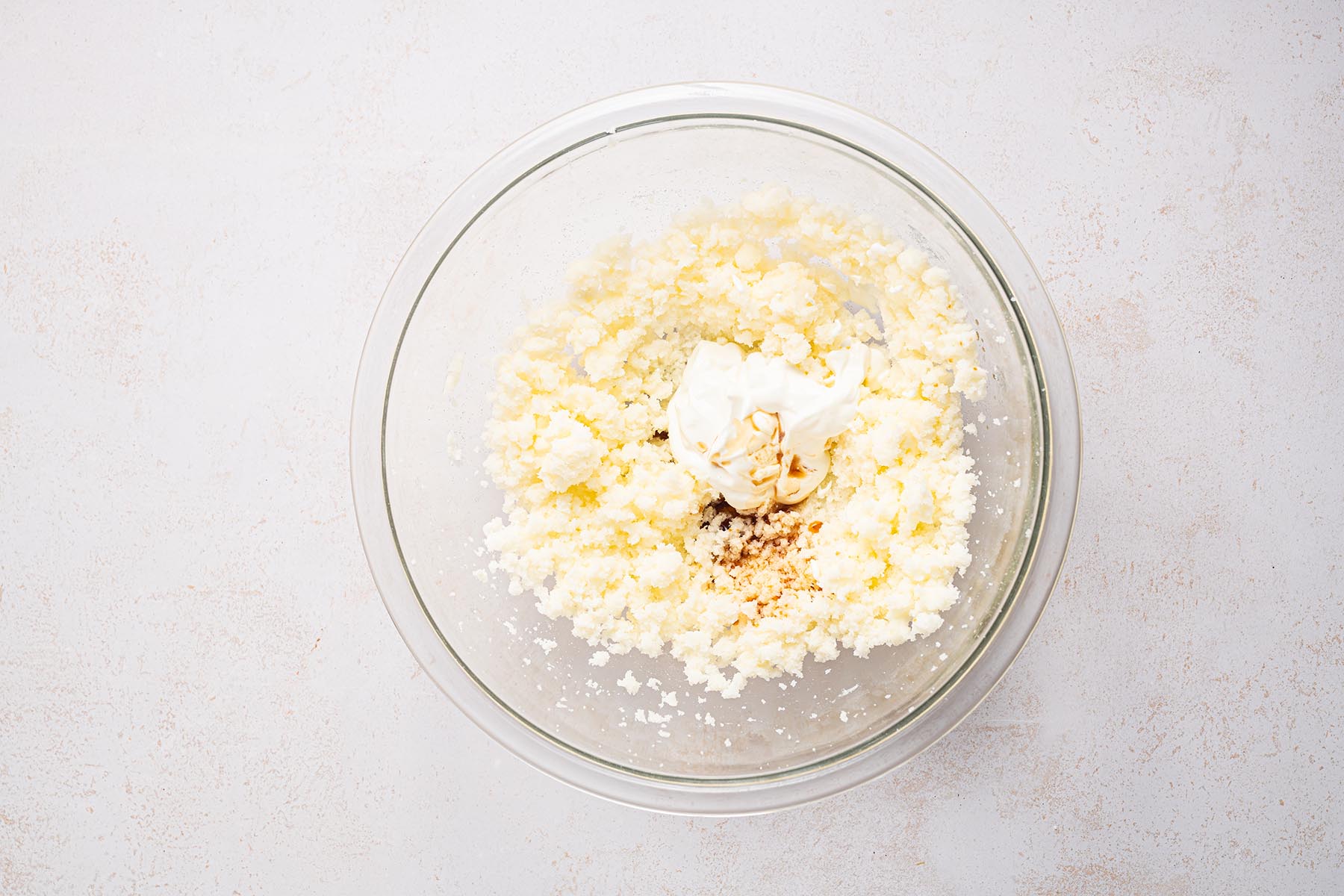 Butter and sugar creamed with sour cream and vanilla.
