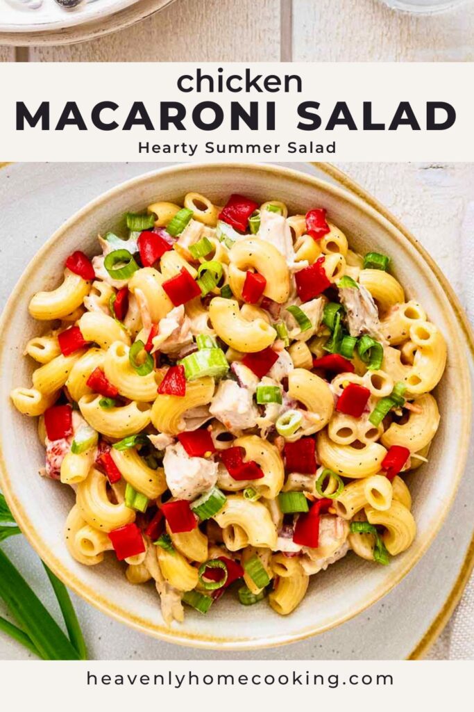 Creamy chicken macaroni salad with elbow macaroni, diced red peppers, green onions, and chunks of chicken in a rustic serving bowl. Vertical Pinterest pin for a hearty chicken macaroni salad summer recipe from Heavenly Home Cooking.