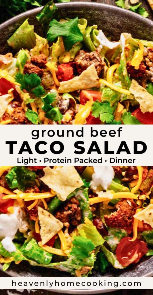 Close-up ground beef taco salad with seasoned beef, lettuce, tomatoes, cheddar cheese, tortilla chips, and creamy dressing in a dark bowl. Vertical Pinterest pin for a light and protein-packed taco salad dinner recipe from Heavenly Home Cooking.