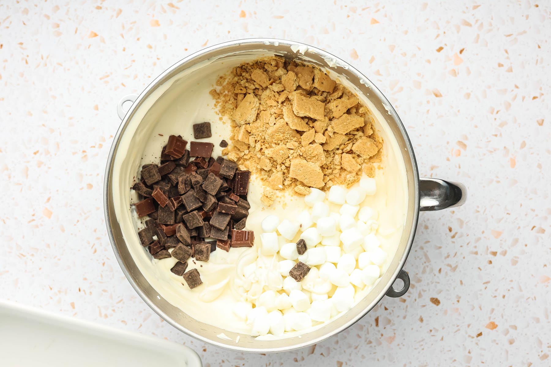 Chocolate chunks, mini marshmallows, and crushed graham crackers added to the ice cream base.
