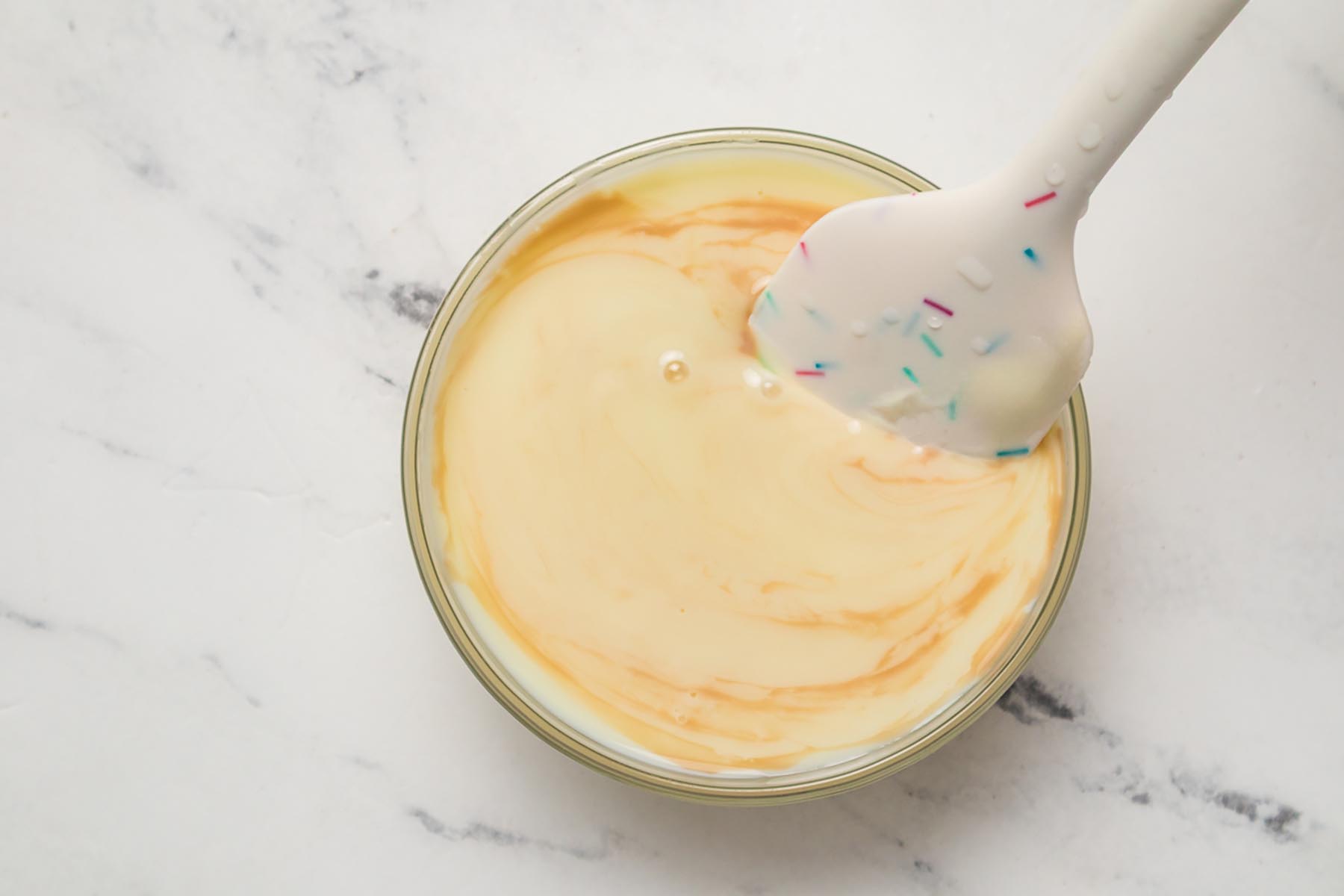 Peach puree folded into sweetened condensed milk mixture for creamy peach ice cream without an ice cream maker.