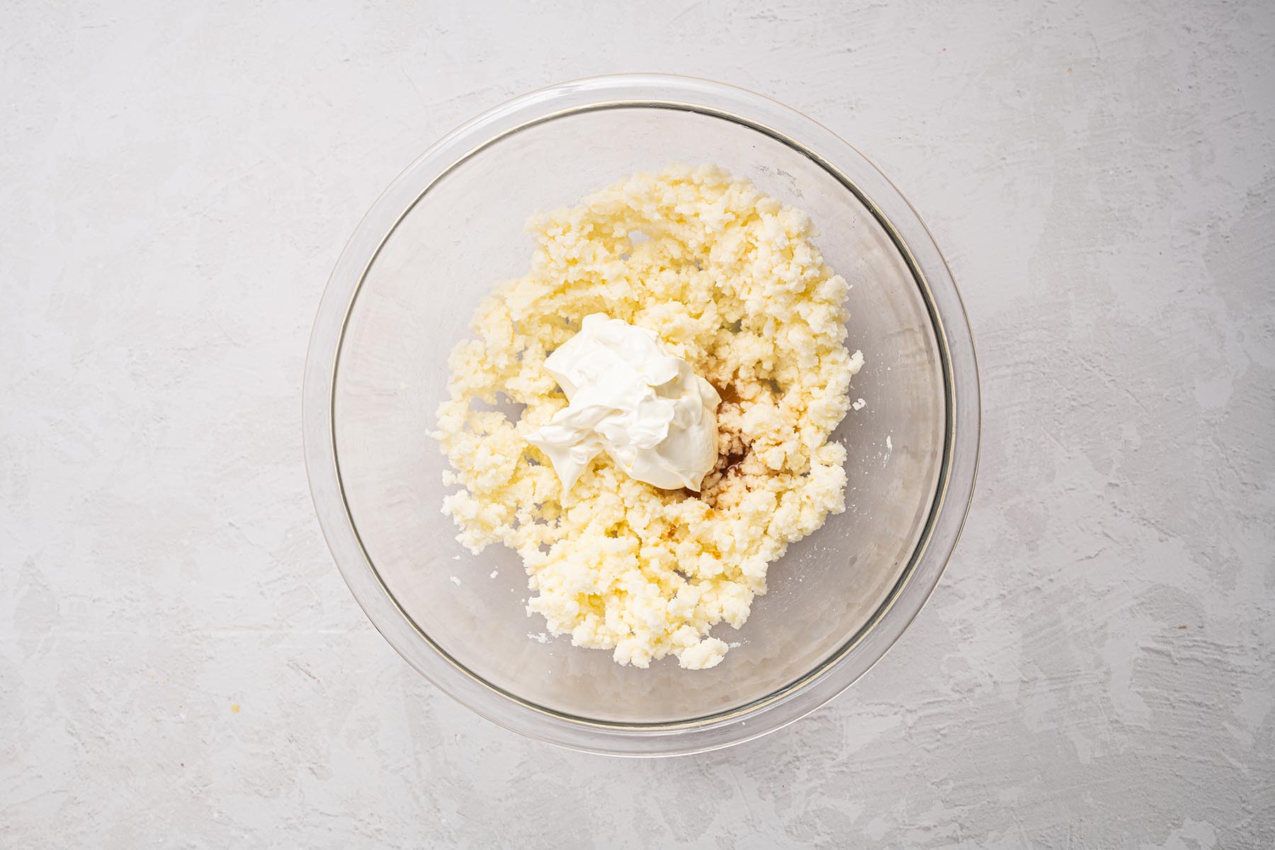 Creamed butter and sugar mixture with sour cream added.