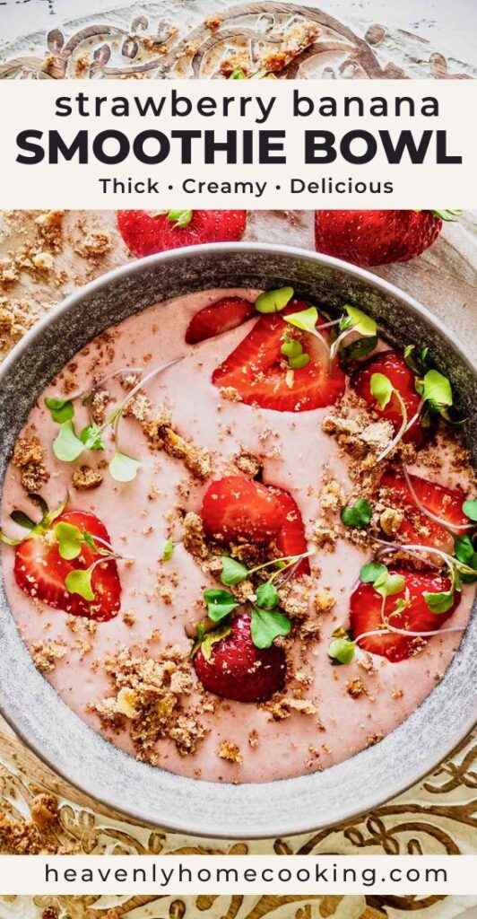 Strawberry banana smoothie bowl topped with fresh strawberries, crunchy crumbs, and microgreens in a gray bowl. Vertical Pinterest pin for a thick and creamy smoothie bowl recipe from Heavenly Home Cooking.
