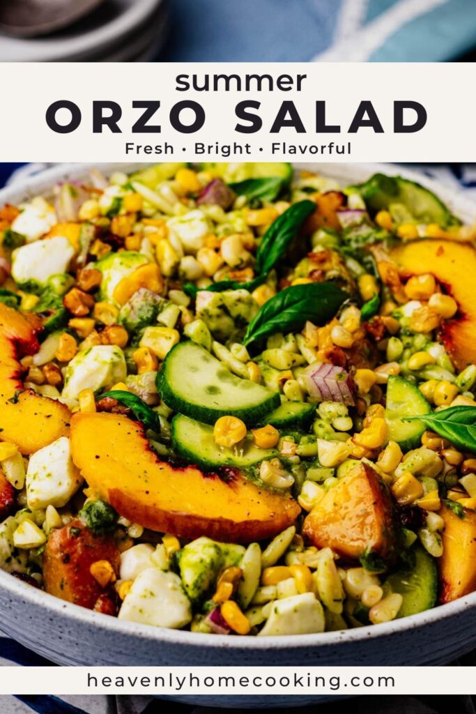Fresh summer orzo salad with peaches, corn, cucumber, mozzarella, basil, and pesto dressing in a large bowl. Vertical Pinterest pin for a colorful summer pasta salad recipe from Heavenly Home Cooking.