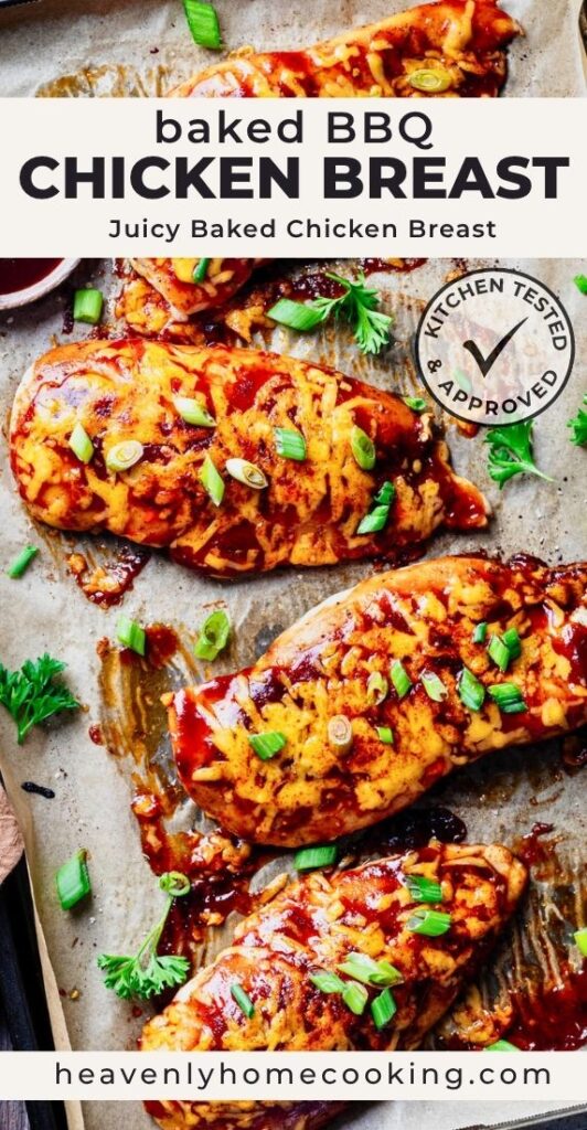Baked BBQ chicken breasts topped with melted cheddar cheese and sliced green onions, arranged on a sheet pan with extra barbecue sauce. Vertical Pinterest pin for a juicy baked BBQ chicken breast recipe from Heavenly Home Cooking.