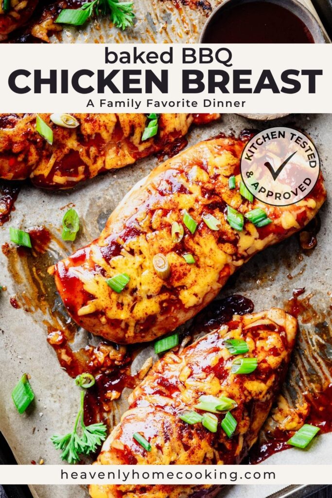 Baked BBQ chicken breasts topped with melted cheddar cheese and green onions, arranged on a sheet pan with extra barbecue sauce. Vertical Pinterest pin for a family-friendly baked BBQ chicken breast dinner recipe from Heavenly Home Cooking.