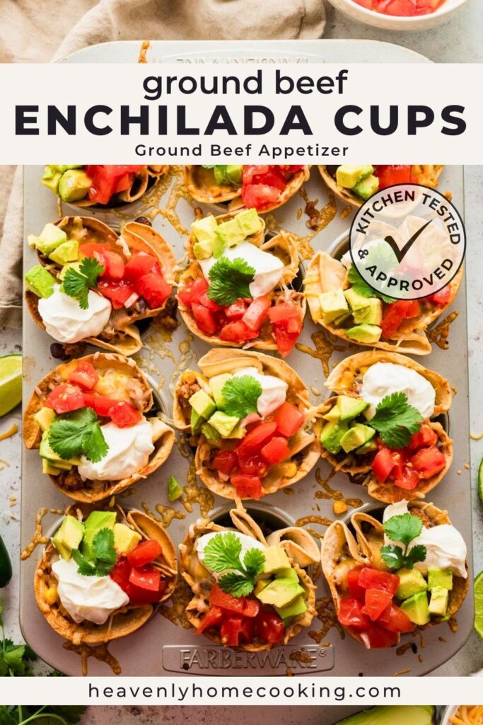 Ground beef enchilada cups baked in a muffin pan and topped with sour cream, diced tomatoes, avocado, and fresh cilantro. Vertical Pinterest pin for an easy ground beef appetizer recipe from Heavenly Home Cooking.