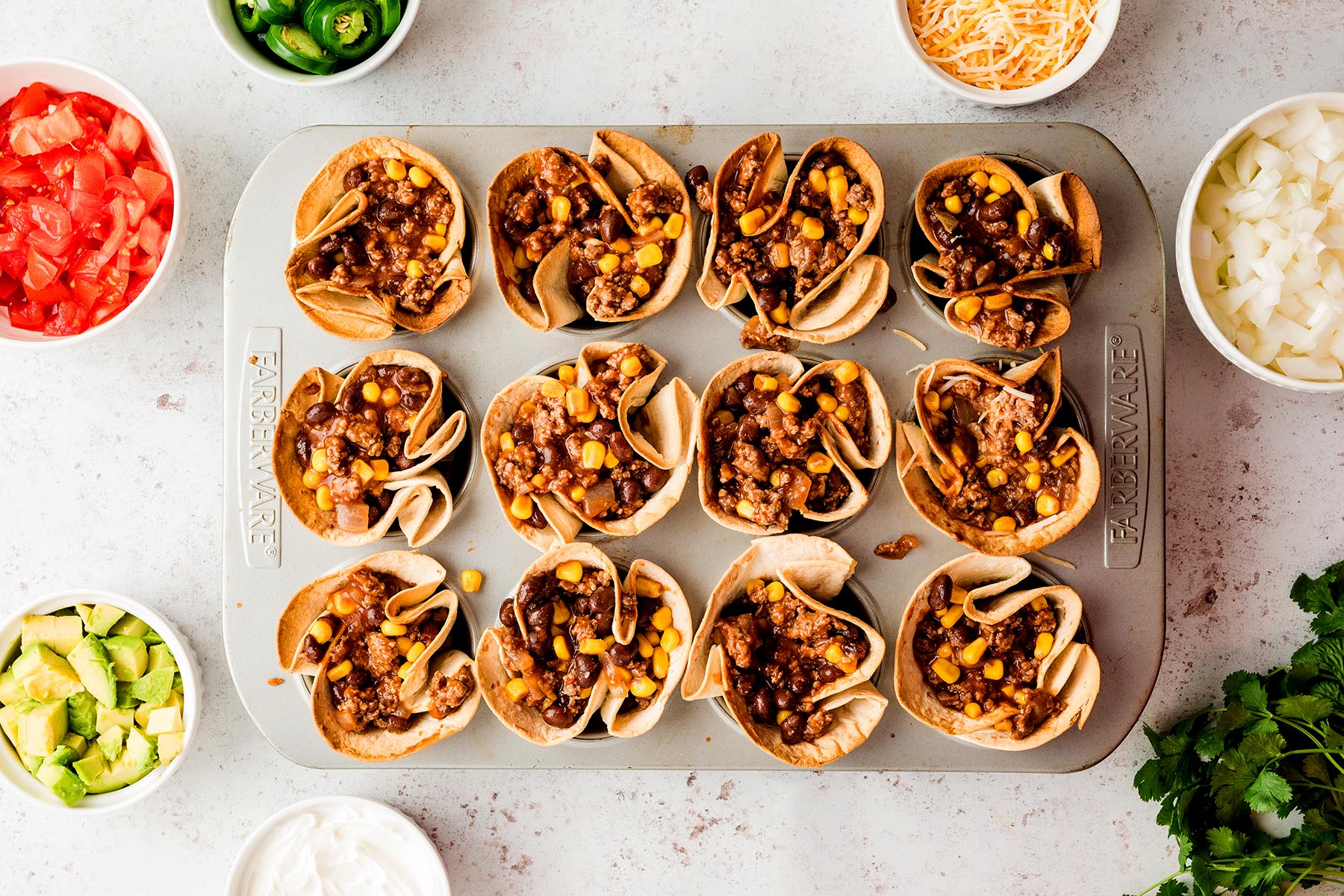 Crispy tortilla shells filled with seasoned beef, black beans, and corn mixture.