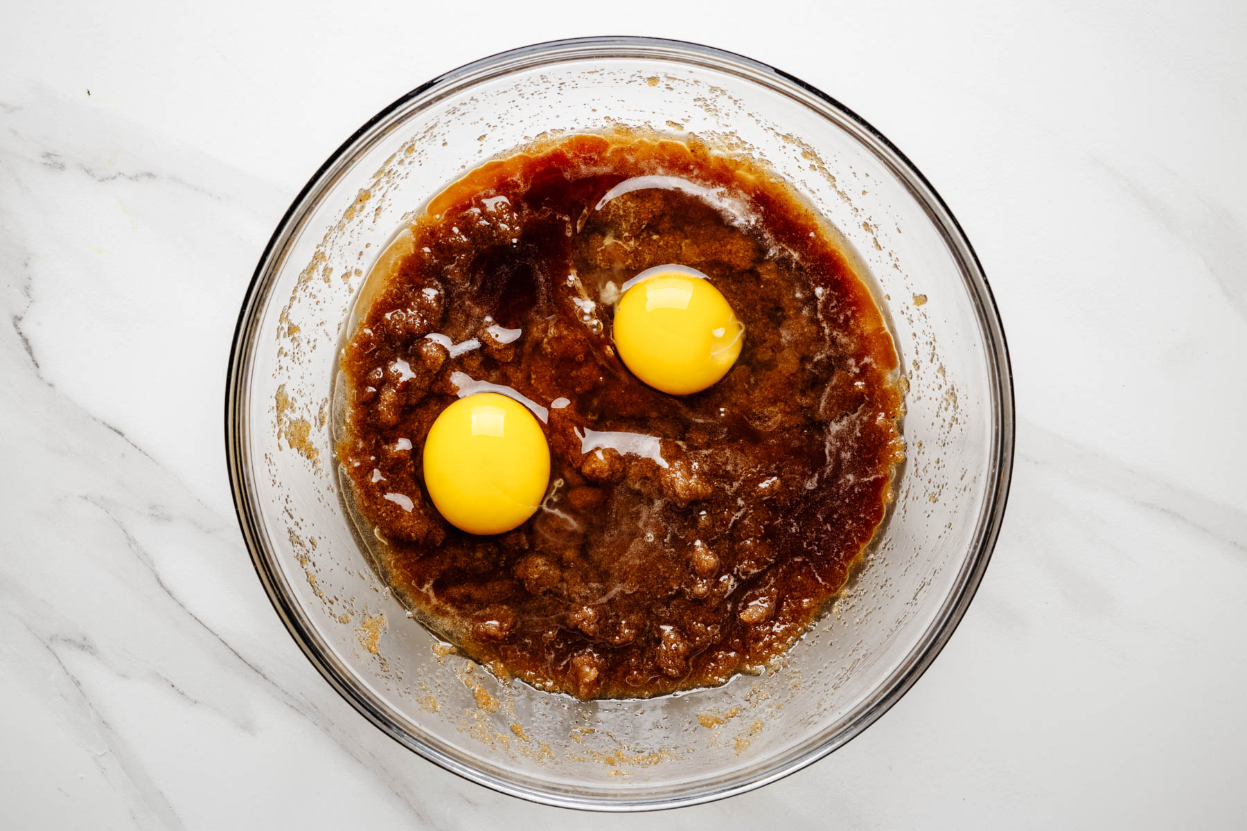 Eggs added to the brown butter and sugar mixture.