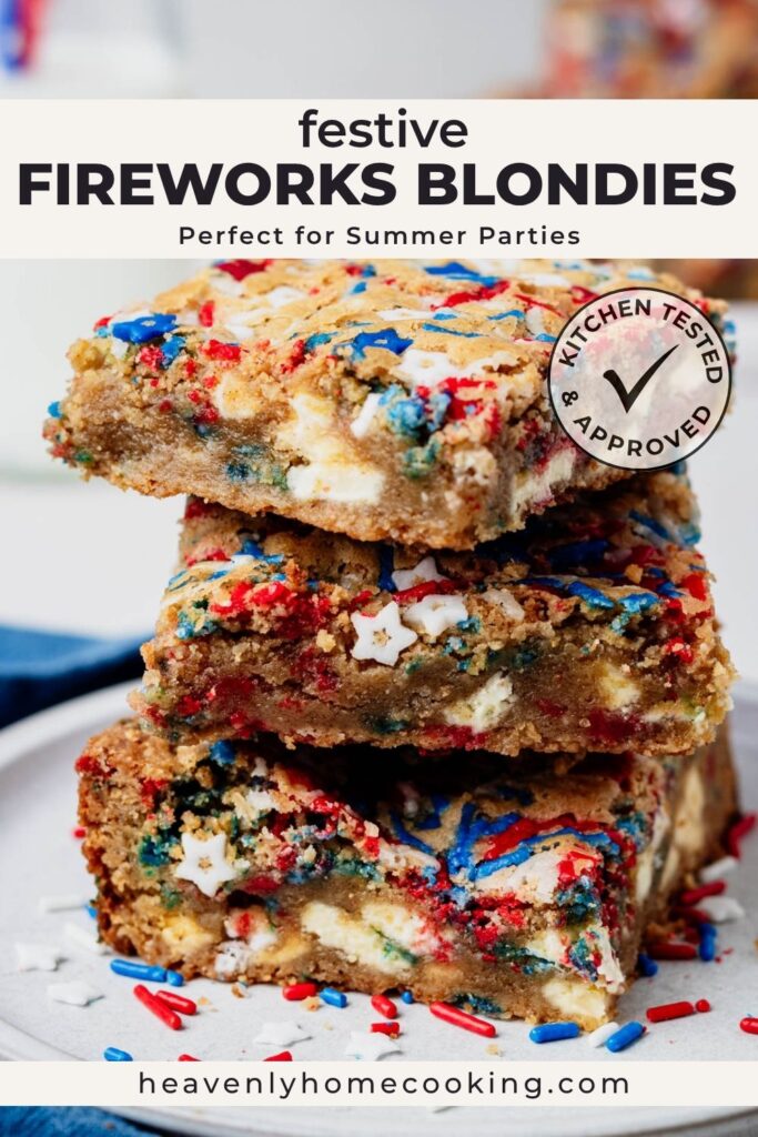 Stack of thick fireworks blondies loaded with white chocolate chunks and red, white, and blue sprinkles. The chewy blondie bars are shown close up with colorful patriotic sprinkles scattered around. Vertical Pinterest pin for festive fireworks blondies, a summer party dessert recipe from Heavenly Home Cooking.