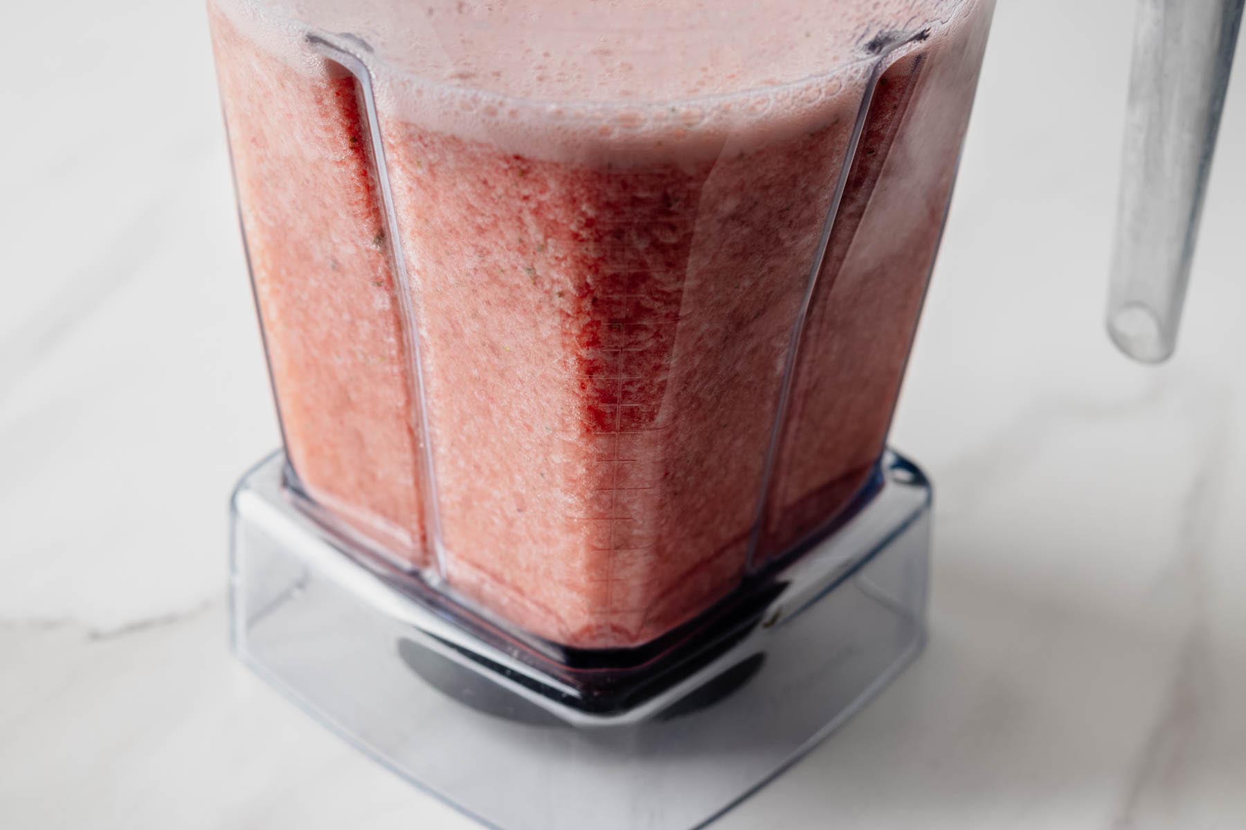 Agua fresca mixture blended until smooth and foamy in a blender pitcher.