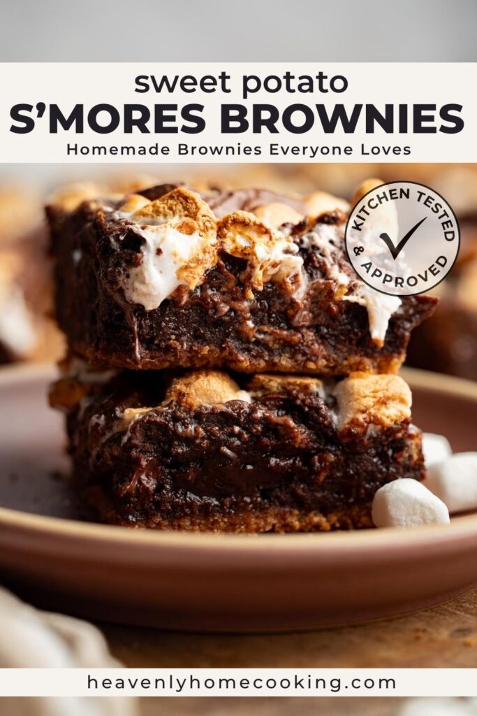 Stack of sweet potato s'mores brownies topped with toasted marshmallows and melted chocolate, showing a rich fudgy interior and graham cracker crust. Vertical Pinterest pin for a homemade sweet potato s'mores brownie recipe from Heavenly Home Cooking.