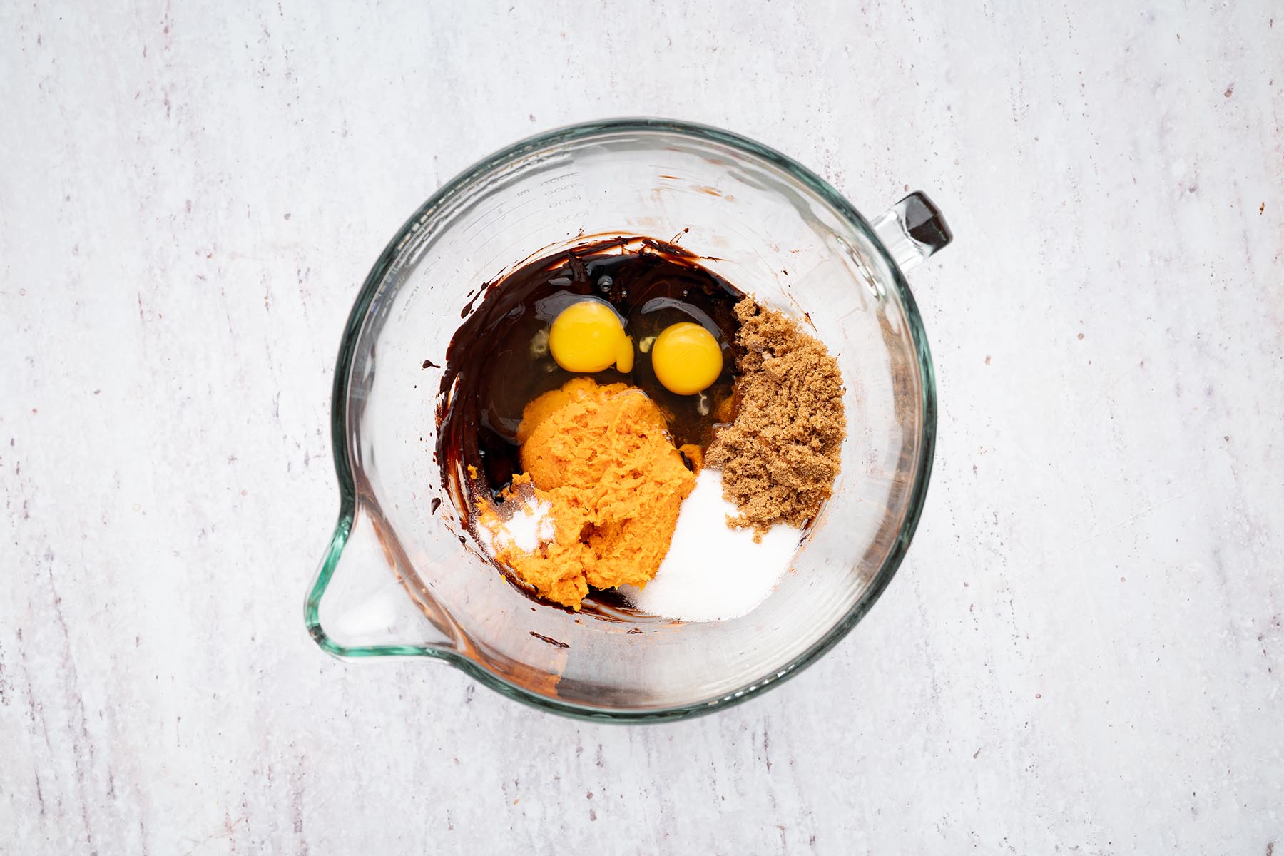 Mashed sweet potato, eggs, sugars, vanilla, and salt added to the chocolate mixture.