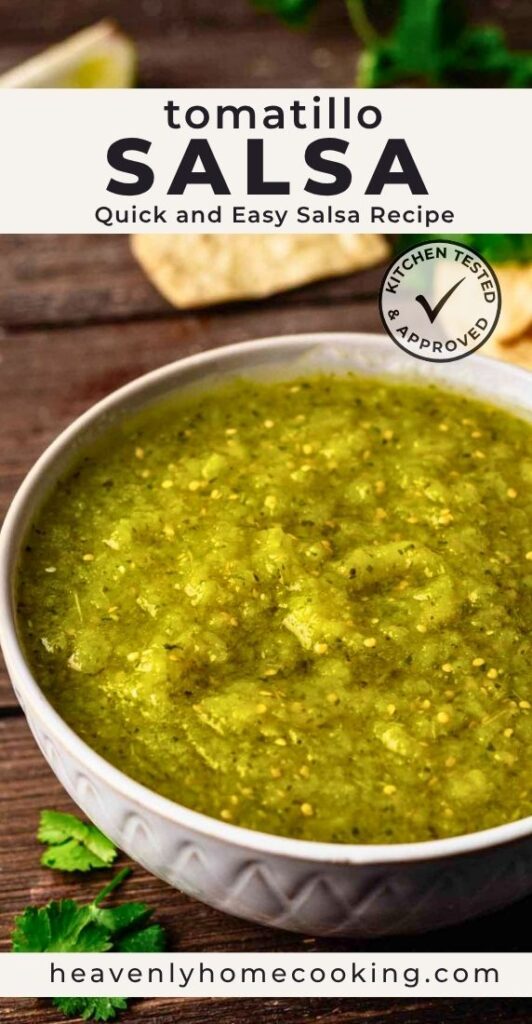 Bowl of homemade tomatillo salsa with visible chunks of tomatillos and cilantro, served with tortilla chips on a wooden surface. Vertical Pinterest pin for a quick and easy tomatillo salsa recipe from Heavenly Home Cooking.
