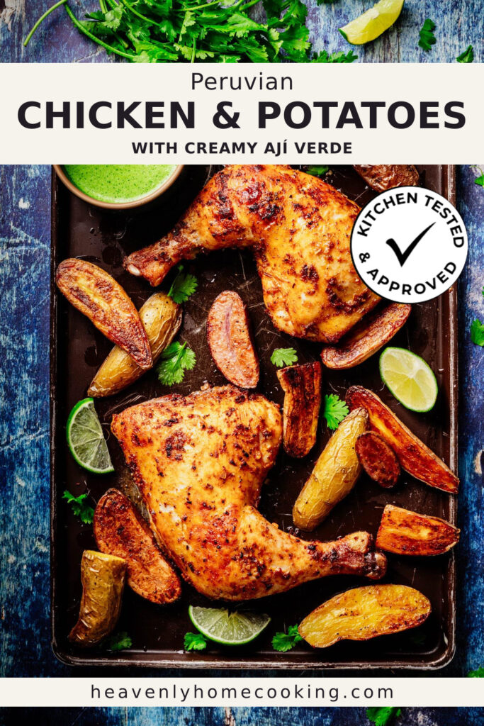 Two golden roasted Peruvian chicken leg quarters are served with crispy roasted baby potatoes, fresh lime wedges, cilantro, and a creamy green ají verde sauce on a dark sheet pan. This vertical Pinterest pin features a homemade Peruvian chicken and potatoes with creamy ají verde recipe from Heavenly Home Cooking.