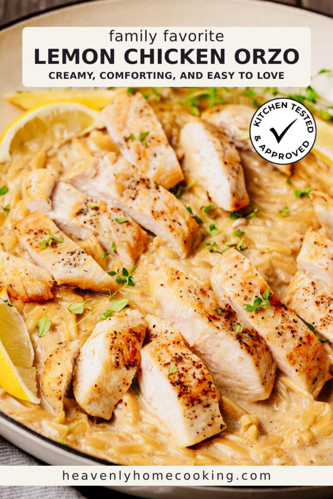 A skillet of creamy lemon chicken orzo features tender slices of pan-seared chicken over rich Parmesan orzo, garnished with fresh thyme and lemon wedges. This vertical Pinterest pin features a homemade lemon chicken orzo recipe from Heavenly Home Cooking.