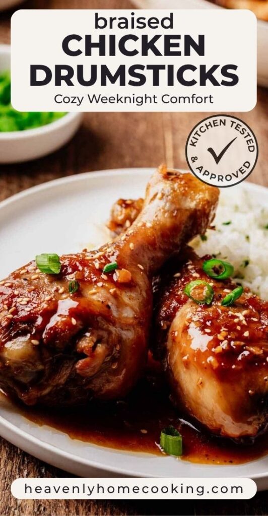 A close-up shows braised chicken drumsticks coated in a rich, glossy sauce and garnished with sliced green onions and sesame seeds, served with white rice. The Pinterest pin includes the text "Braised Chicken Drumsticks – Cozy Weeknight Comfort." This vertical Pinterest pin features a homemade braised chicken drumsticks recipe from Heavenly Home Cooking.