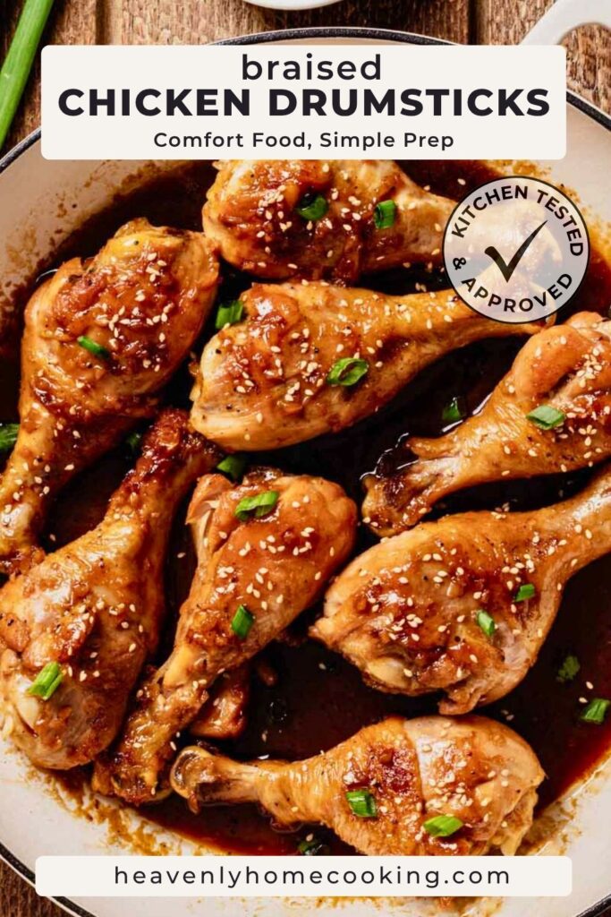 An overhead view shows braised chicken drumsticks simmering in a rich, glossy sauce and garnished with sesame seeds and sliced green onions in a skillet. The Pinterest pin includes the text "Braised Chicken Drumsticks – Comfort Food, Simple Prep." This vertical Pinterest pin features a homemade braised chicken drumsticks recipe from Heavenly Home Cooking.