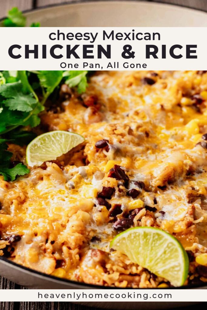 A skillet of cheesy Mexican chicken and rice is topped with melted cheese, black beans, corn, and lime wedges, with fresh cilantro alongside. The Pinterest pin includes the text "Cheesy Mexican Chicken & Rice – One Pan, All Gone." This vertical Pinterest pin features a homemade cheesy Mexican chicken and rice recipe from Heavenly Home Cooking.