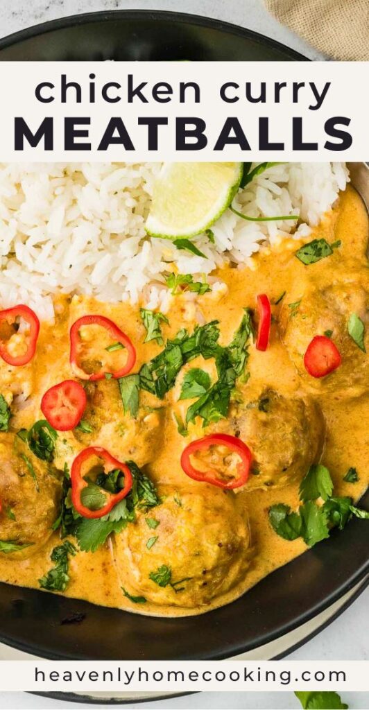 A bowl of chicken curry meatballs is served over fluffy white rice and covered in a creamy golden curry sauce, then garnished with fresh cilantro, sliced red chiles, and a lime wedge. The Pinterest pin includes the text "Chicken Curry Meatballs." This vertical Pinterest pin features a homemade chicken curry meatballs recipe from Heavenly Home Cooking.