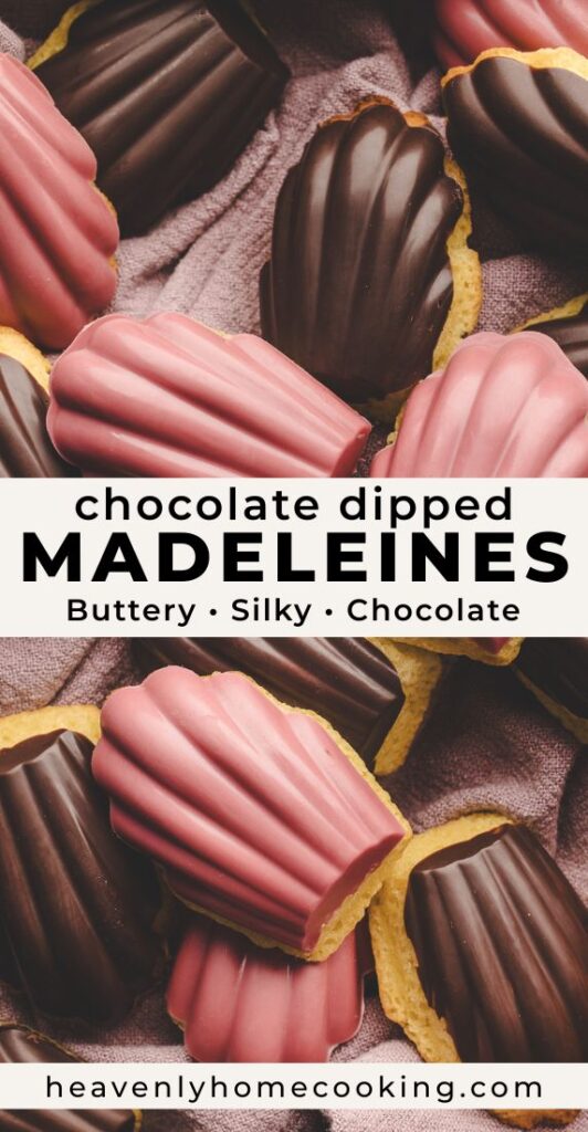 Chocolate-dipped madeleines coated in dark chocolate and pink chocolate are arranged on a textured mauve cloth, highlighting their crisp shell shape and smooth chocolate finish. This vertical Pinterest pin features a homemade chocolate dipped madeleines recipe from Heavenly Home Cooking.