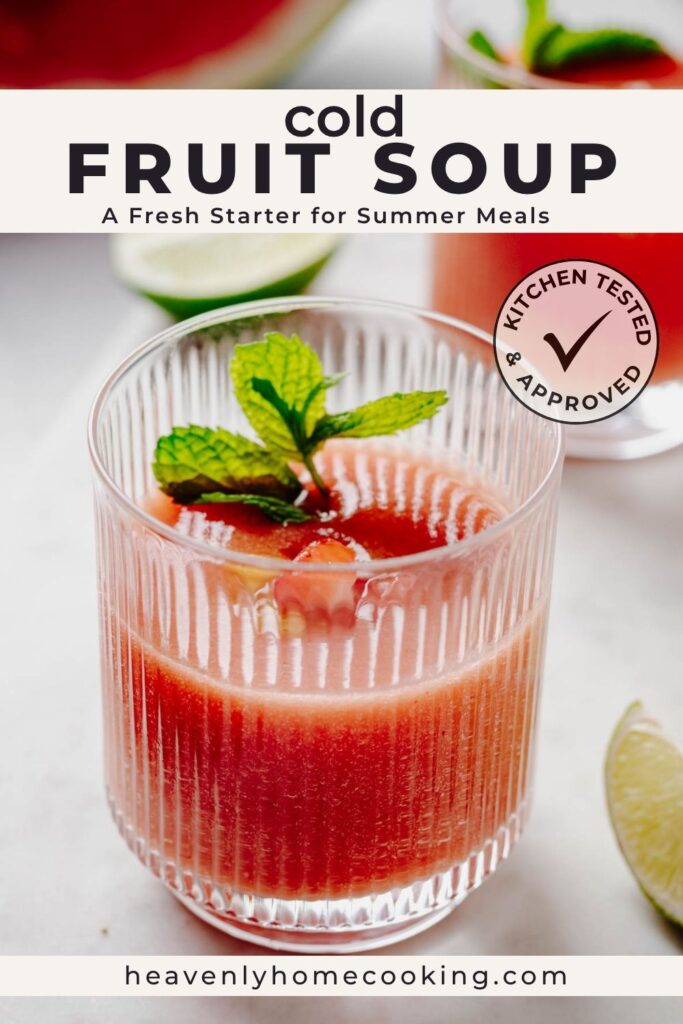 Cold fruit soup served in a fluted glass and garnished with diced peaches, strawberries, and fresh mint. Text reads “Cold Fruit Soup: A Fresh Starter for Summer Meals.” This is a vertical Pinterest pin for a homemade recipe from Heavenly Home Cooking.