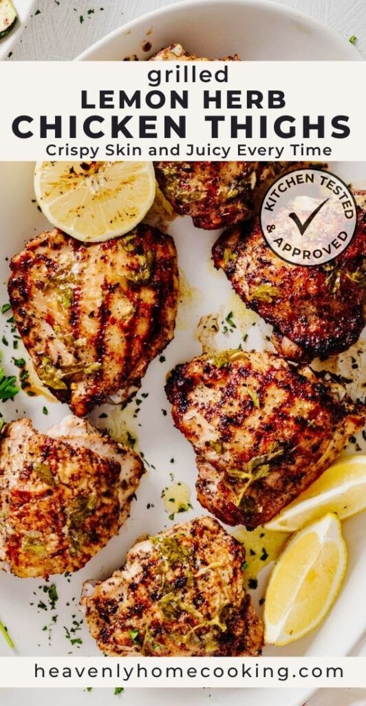 A platter of grilled lemon herb chicken thighs with crispy, charred skin, garnished with grilled lemon halves, fresh herbs, and lemon wedges. This vertical Pinterest pin features a homemade grilled lemon herb chicken thighs recipe from Heavenly Home Cooking.
