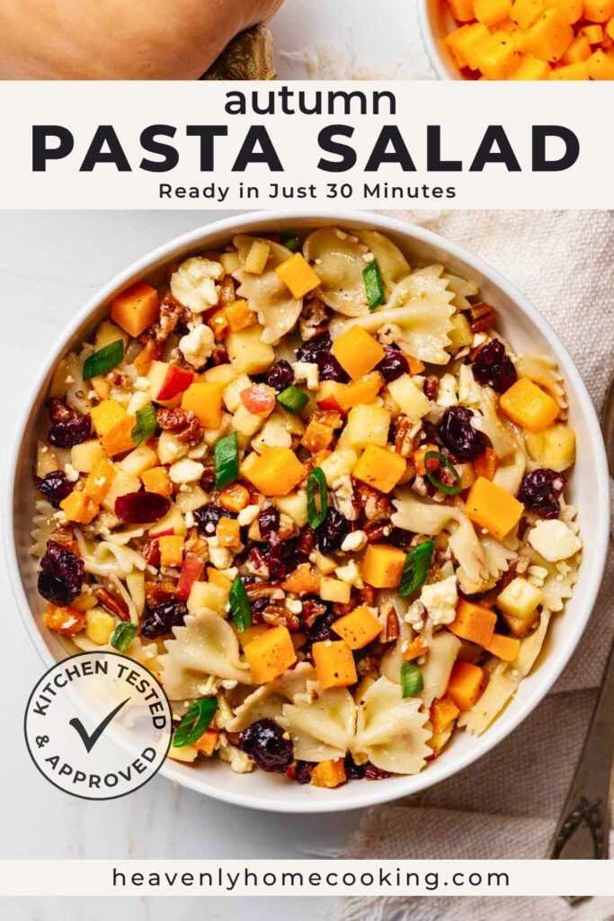 Bowl of autumn pasta salad made with bow tie pasta, roasted butternut squash, apples, cranberries, feta, pecans, and green onions in a tangy honey Dijon dressing. This easy fall side dish comes together in about 30 minutes and is ideal for Thanksgiving, potlucks, and weeknight dinners.