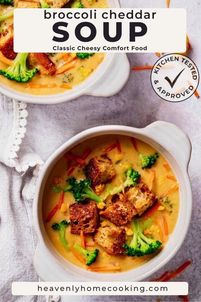 Overhead view of bowls of creamy broccoli cheddar soup topped with broccoli, carrots, cheddar, and crisp croutons. This is a Pinterest pin for a Heavenly Home Cooking recipe.