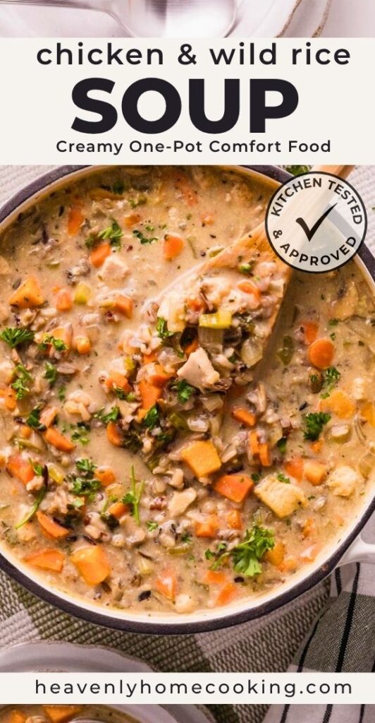 Pot of creamy chicken and wild rice soup with tender chicken, wild rice, carrots, celery, mushrooms, and fresh parsley. This is a Pinterest pin for a Heavenly Home Cooking recipe.