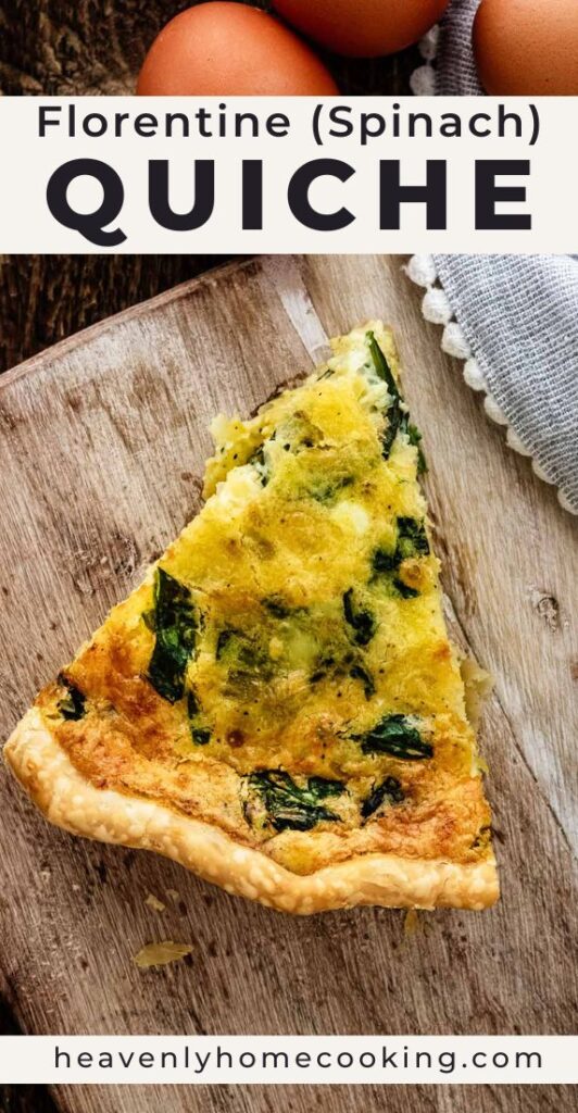 Slice of spinach quiche Florentine with a golden crust and cheesy spinach filling on a wooden serving board.