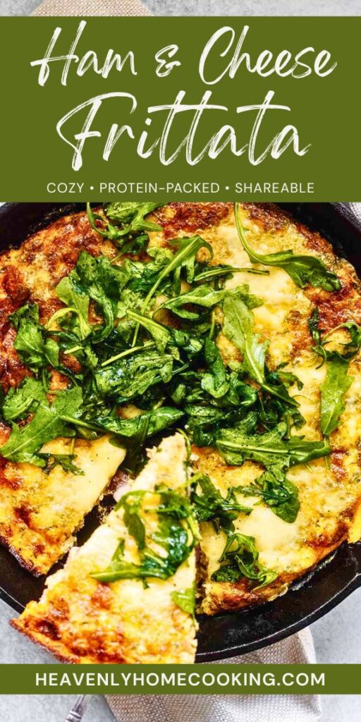 Golden ham and cheese frittata in a cast-iron skillet topped with fresh arugula, with one slice pulled forward. Pinterest pin reads “Ham & Cheese Frittata – Cozy, Protein-Packed, Shareable” and features Heavenly Home Cooking branding.