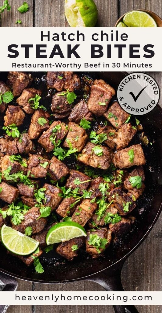 Browned Hatch chile steak bites garnished with cilantro and lime wedges in a cast-iron skillet. This is a Pinterest pin for a Heavenly Home Cooking recipe.