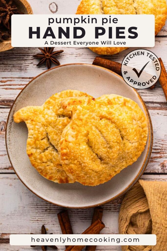 Pinterest pin for pumpkin pie hand pies showing two flaky, golden pastries on a rustic plate surrounded by cinnamon sticks and star anise. The text overlay reads "Pumpkin Pie Hand Pies – A Dessert Everyone Will Love." Includes a Kitchen Tested & Approved badge and Heavenly Home Cooking branding.