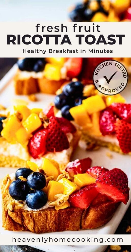 Fresh fruit ricotta toast with creamy whipped ricotta, strawberries, blueberries, mango, and granola, from Heavenly Home Cooking.
