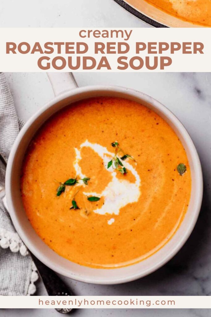 Overhead bowl of creamy roasted red pepper and Gouda soup with a swirl of cream and fresh herbs. This is a Pinterest pin for a Heavenly Home Cooking recipe.