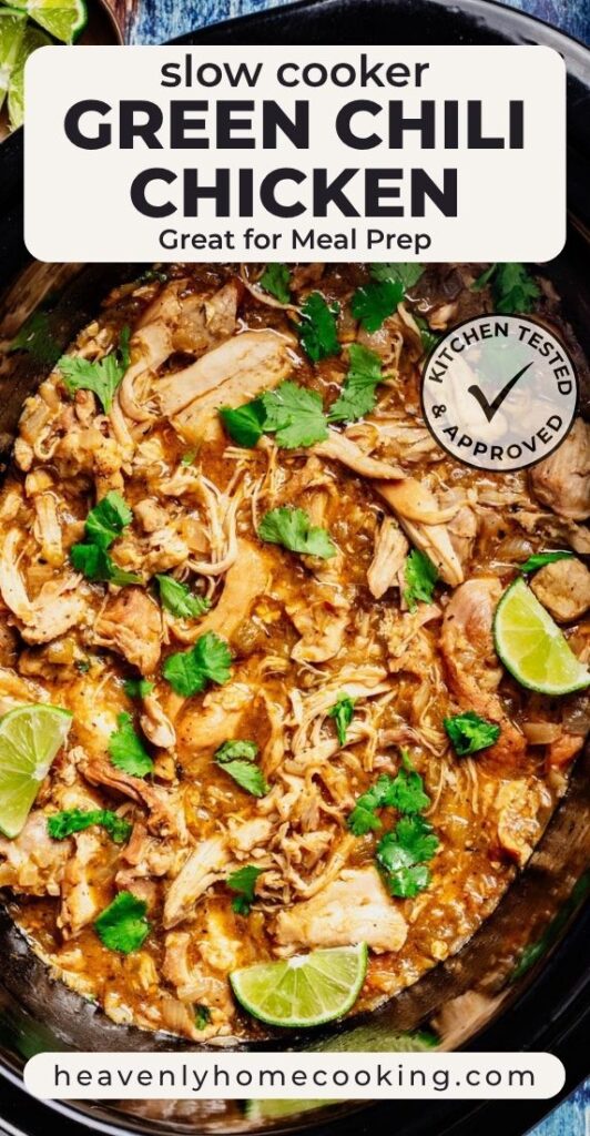 Vertical Pinterest pin for slow cooker green chili chicken featuring a close-up of tender shredded chicken simmered in a rich green chili sauce, garnished with fresh cilantro and lime wedges. The text overlay reads "Slow Cooker Green Chili Chicken" with the subtitle "Great for Meal Prep," and includes a Kitchen Tested & Approved badge and the Heavenly Home Cooking logo.